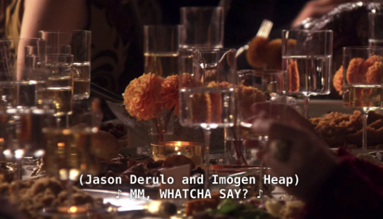 A screenshot from the thanksgiving episode of Gossip Girl, where there is a closed caption from the song "MMM Watchya Say" by Jason Derulo and Imogen Heap. 
